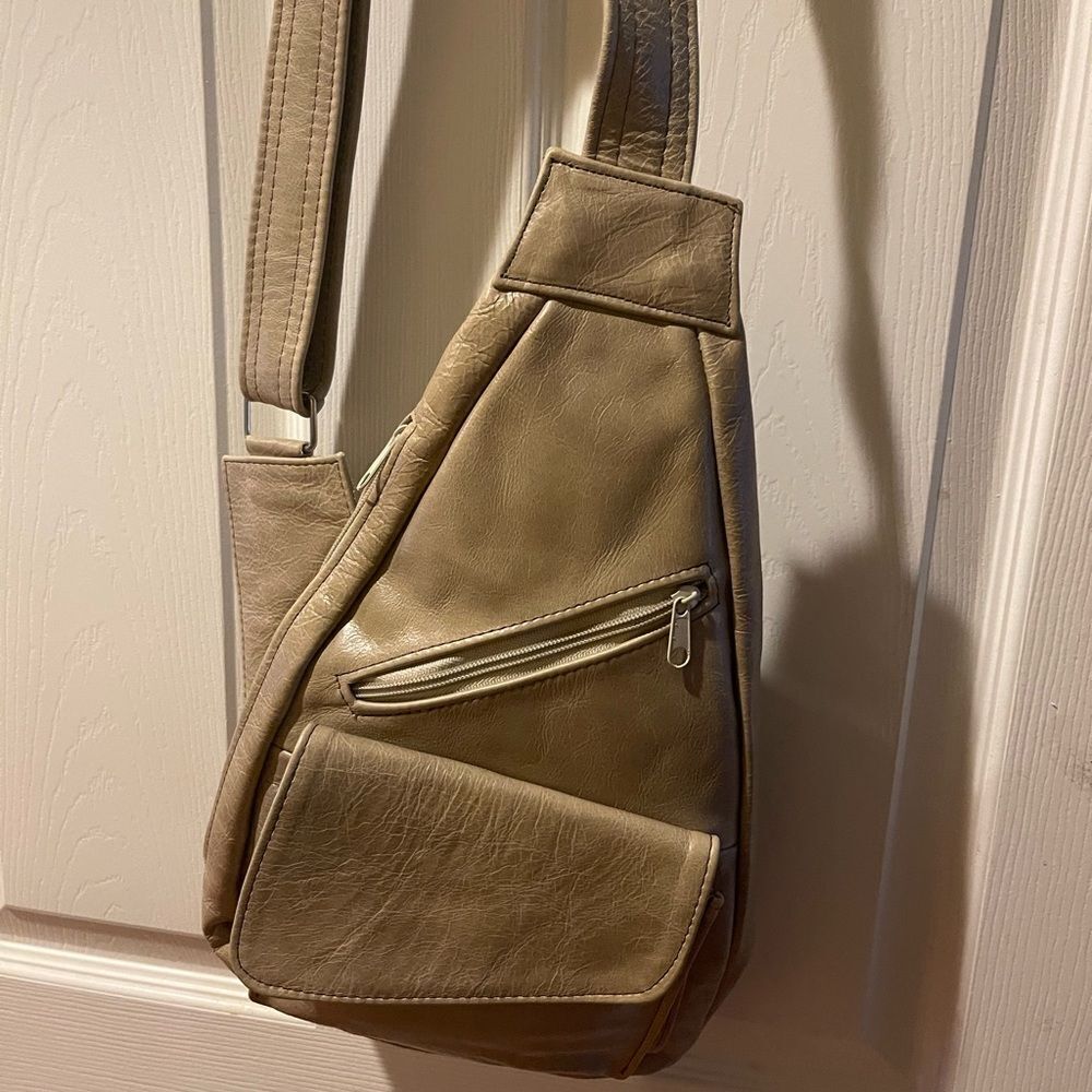 Stylish khaki Leather small Sling Bag. Adjustable strap.